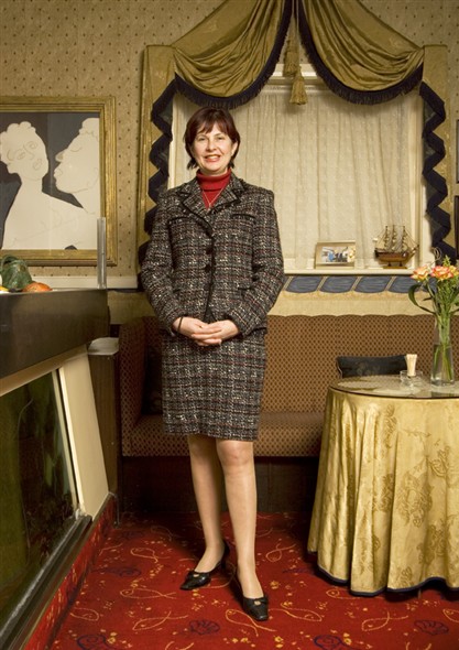 Photo:Portrait of Mirium Kikis standing in the restaurant