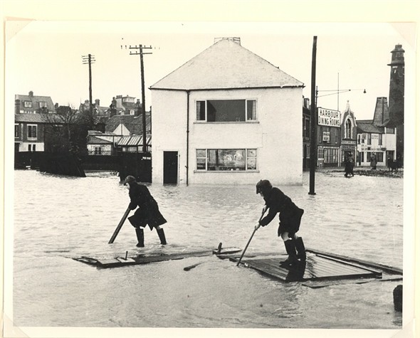 Photo:Two boys rafting on the flood waters, 1953