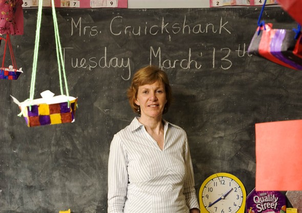 Photo:Close-up of Mrs Cruickshank infront of the blackboard in her classroom