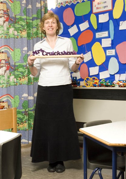 Photo:Potrait of Mrs Cruickshank holding a gift from one of her pupils