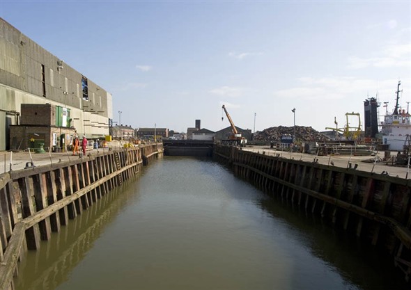 Photo:View of the empty dry dock filled with water