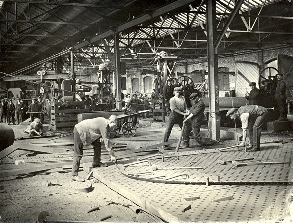 Photo:Men working in one of the sheds in the shipyard